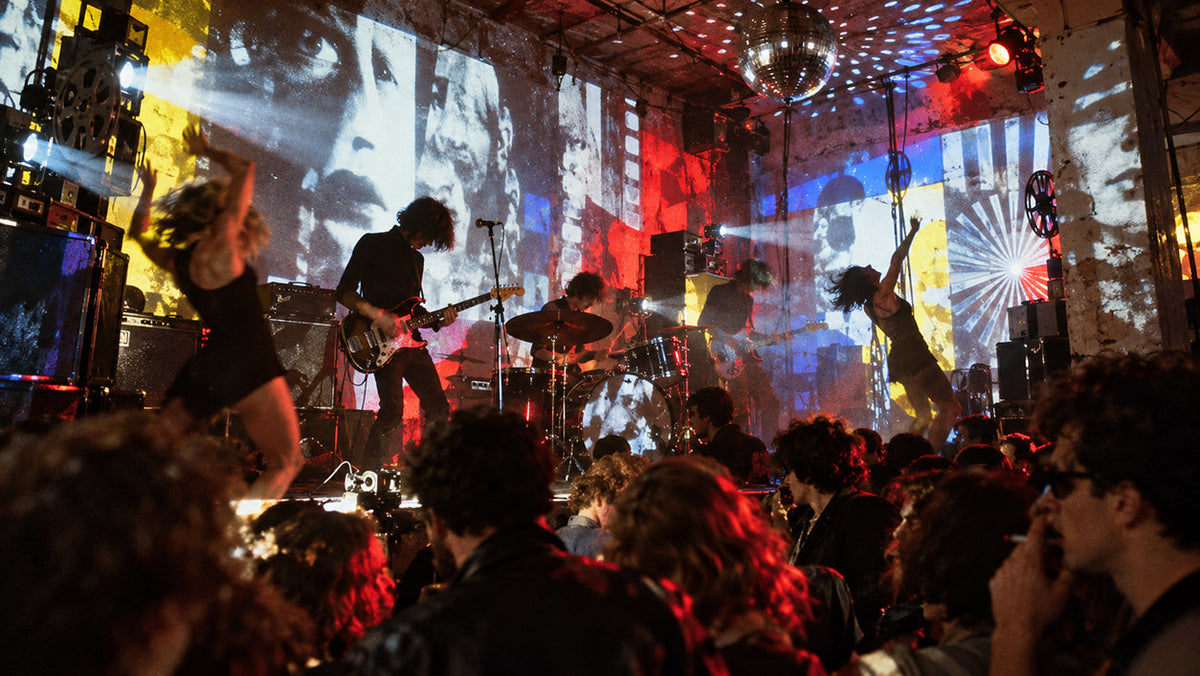 1966 New York underground multimedia performance with a rock band, dancers, overlapping film projections, coloured slides and strobe lights filling a crowded dance hall