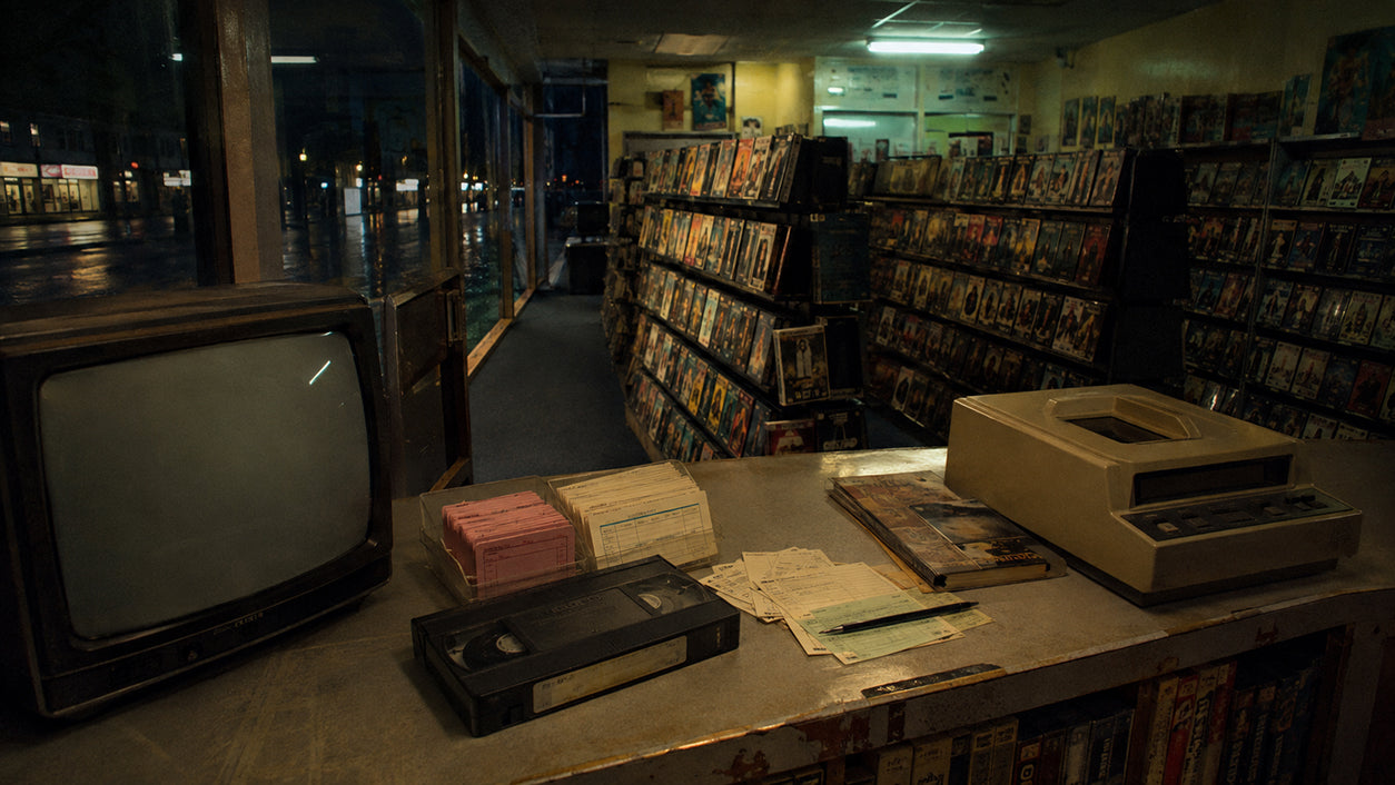 Late-1980s British video rental shop filled with VHS tapes after closing time